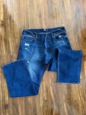 Hollister Men's Dark Blue Bootcut Jeans with Subtle Distressing